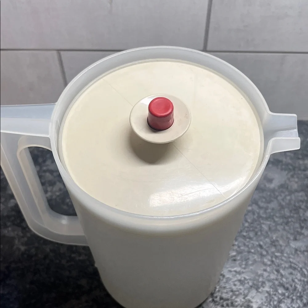 Vintage semi sheer push button Pitcher with Rust Accent. Excellent condition